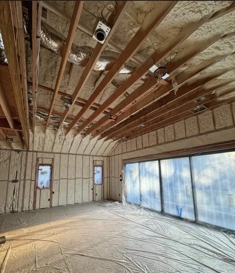 Interior walls and ceiling insulated with spray foam during new construction in St. Albans
